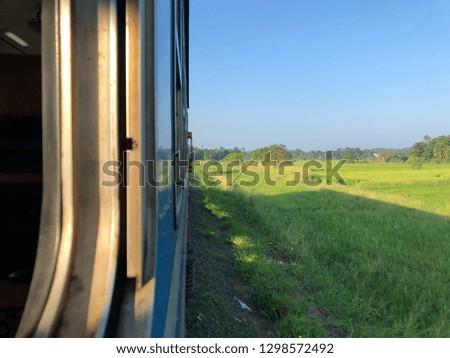 Sri Lanka by train. The beauty of the natural landscape in Sri Lanka can be seen in this photo, with a subtle indication of the train offering a contrast between the nature and man-made machinery.