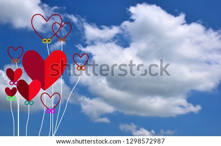 red paper heart in the sky