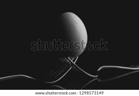An egg on forks