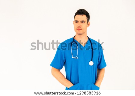 Male doctor in hospital uniform standing on white background. Healthcare and medical concept.
