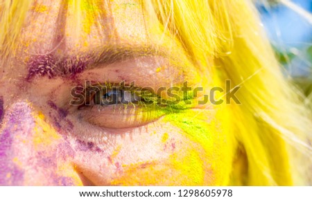 Holi Colorful festival of colored paints of powders and dust. People covered with colored powder rejoice celebrate and dance. Holiday bright colors for the entertainment of people.