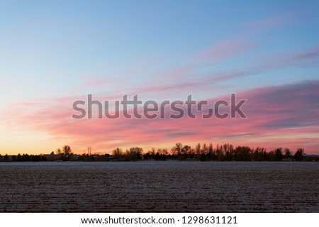 A Beautiful Early Morning Sunrise in a Rural Area of Colorado with Colorful Clouds