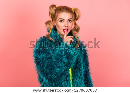 Minimal fashion Pop Art girl. Vanilla pastel pink colors. Girl in a fur coat