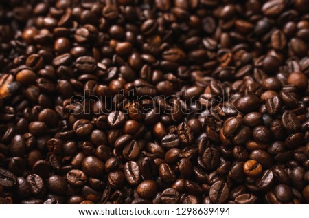 Coffee beans. Roasted coffee beans background. Coffee background close up. Authentic natural coffee. Comercial use.