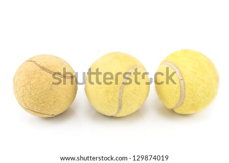 Three used tennis balls on white background