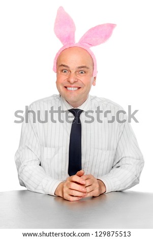 Funny picture of an successful manager with rabbit ears. Happy easter for your company.
