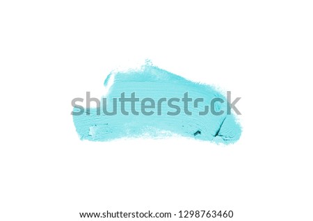 Smear and texture of lipstick or acrylic paint isolated on white background. Stroke of lipgloss or liquid nail polish swatch smudge sample. Element for beauty cosmetic design. Light blue color