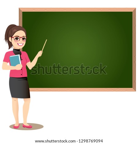Female teacher in classroom teaching lesson pointing at greenboard and holding book  Royalty-Free Stock Photo #1298769094