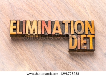 elimination diet word abstract in vintage letterpress wood type printing blocks