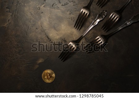  golden bitcoin with silver forks 