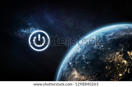 Earth Day theme. Earth hour. Poaer button near planet. Elements of this image furnished by NASA