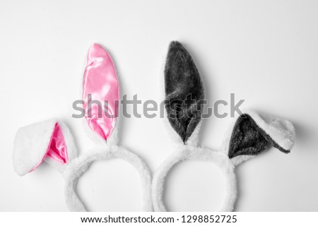 Top view of two rabbit ears on white background pink and couple love holiday easter concept