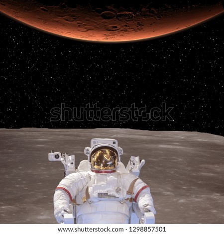 Alien planet landscape. Astronaut. Stars. The elements of this image furnished by NASA.
