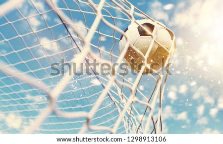 Soccer ball in goal, sport concept Royalty-Free Stock Photo #1298913106
