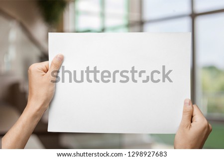 Hands holding  blank book isolated on  background