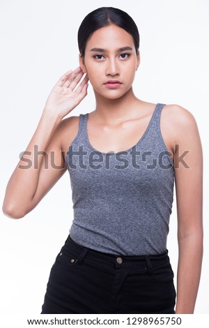 Asian Woman after applying make up black straight hair gray vast. no retouch, Fashion clean make up face with cheek, smooth skin. Studio lighting white background, for aesthetics therapy treatment
