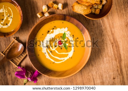 Pumpkin soup is one of the best fall soups you’ll ever taste. It is a diet food for those who want to lose weight. And is a vegetarian favorite. Present this picture as copy space.