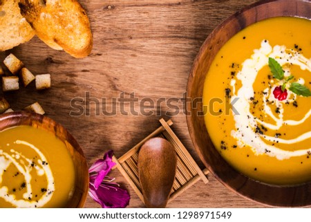 Pumpkin soup is one of the best fall soups you’ll ever taste. It is a diet food for those who want to lose weight. And is a vegetarian favorite. Present this picture as top view and copy space.