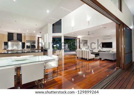 Luxurious home interior with large sliding doors Royalty-Free Stock Photo #129899264