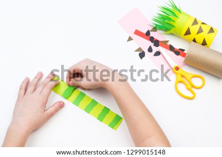 Child does the handicraft. Fruit paper. Pineapple and Watermelon summer. Favorite hobby. Kindergarten and school.