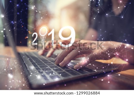 Businesswoman using laptop, searching web, browsing information, having workplace at office / Business new year 2019 concept