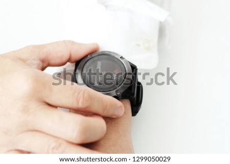 Close up Men's hands are using the watch to set the heart wave measurement for health.