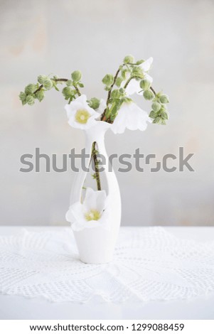 still life with flowers in white vase
