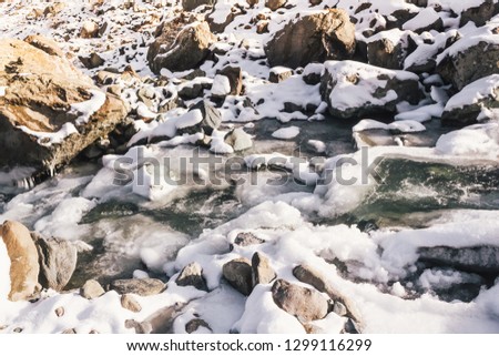 Fast mountain river. Water among stones