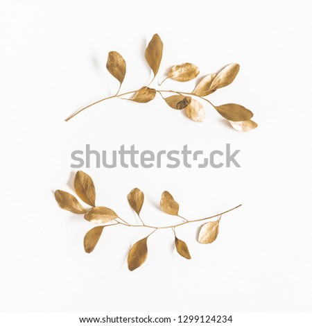Eucalyptus leaves on white background. Wreath made of golden eucalyptus branches. Flat lay, top view, copy space, square Royalty-Free Stock Photo #1299124234