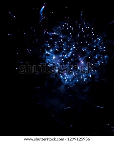 lights from fireworks on black background