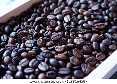 coffee beans on wood tray