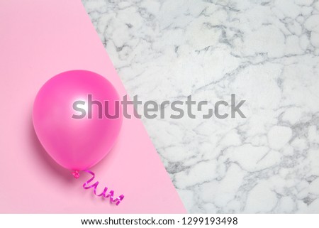 Bright balloon on colorful background, top view with space for text. Party time