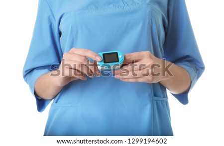 Female doctor using heart rate monitor on white background, closeup. Medical object