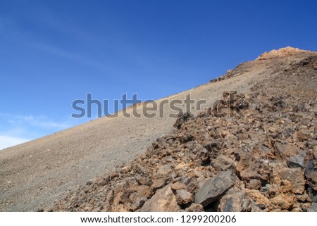 Peak of the Teide volcano, the famous volcano of Tenerife in the Canary Islands, Spain. Rocky slope of the crater seen from below.