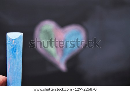 chalk and colorful heart on blackboard, valentines concept