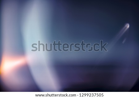 Designed film texture background with heavy grain, dust and a light leak Real Lens Flare Shot in Studio over Black Background. Easy to add as Overlay or Screen Filter over Photos overlay Royalty-Free Stock Photo #1299237505