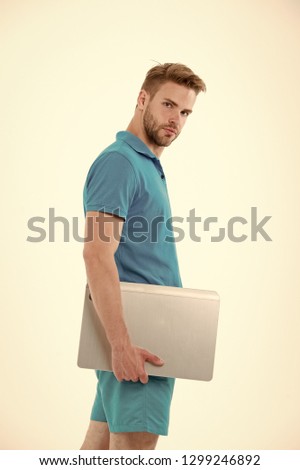 Man with laptop in blue sport clothes. Sportsman with computer for internet game. Sport bets and gambling online. New technology for modern life. Fashion for sport and fitness activity.