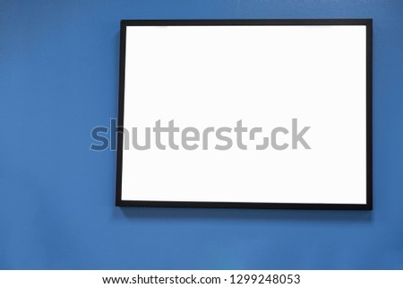 Black picture frame on blue wall Copy space With text input area background