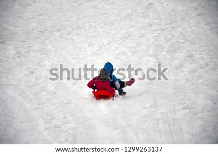 children playin in the snow