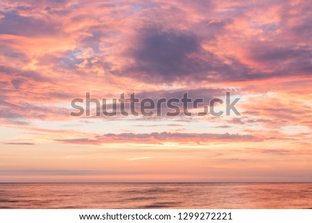 Sunset on the Latvian Coast in Summer Royalty-Free Stock Photo #1299272221