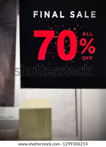70 percent discount red banner on display in a department store.​Discounts on Chinese New Year's Day.Sign of sale shopping.