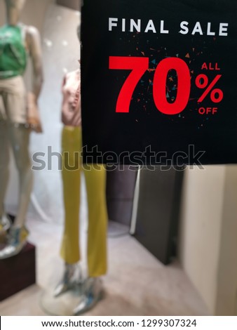 70 percent discount red banner on display in a department store.​Discounts on Chinese New Year's Day.Sign of sale shopping.