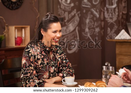 Beautiful young couple having a great night in a hipster pub. Fliting.