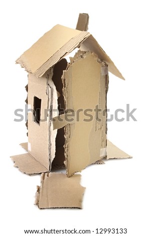 Model house made of torn corrugated cardboard and tape, isolated on white.