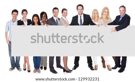 Group of business people presenting empty banner. Isolated on white
