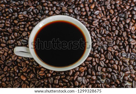 Hot coffee on coffee beans