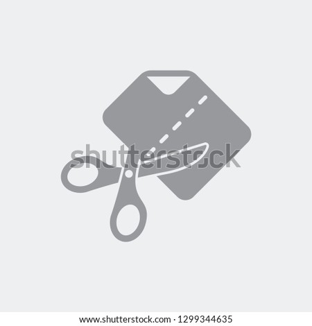 Scissors cutting a sheet