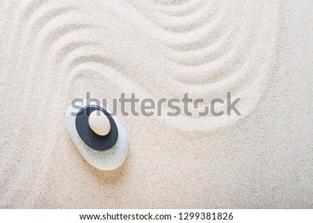 zen garden meditation stone background. Stones and lines in the sand for the balance of relaxation and harmony of spirituality or spa health