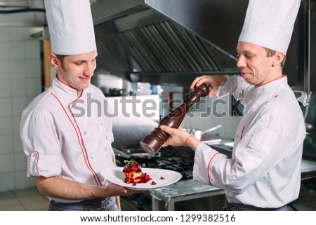 Two Chefs Sha background kitchen pepper dishes