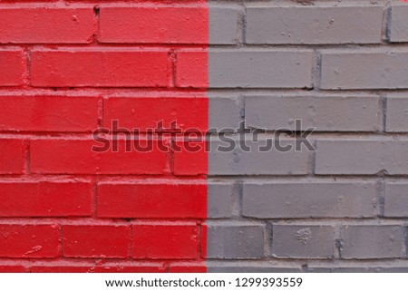 Colorful (grey and red) brick wall as background, texture